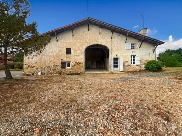 GRANGE EN PIERRE - SÉCHOIR RÉHABILITABLE - DOUBLE GARAGE - TERRAIN CONSTRUCTIBLE