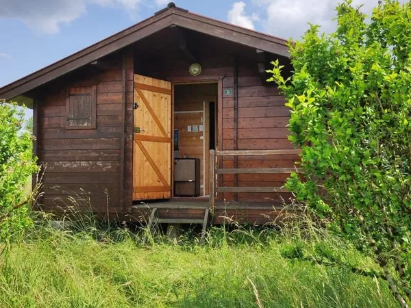 À vendre Terrain constructible de 12,99 ares avec chalet à rénover