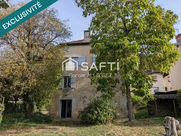Belle grande maison atypique avec garage et terrain arboré
