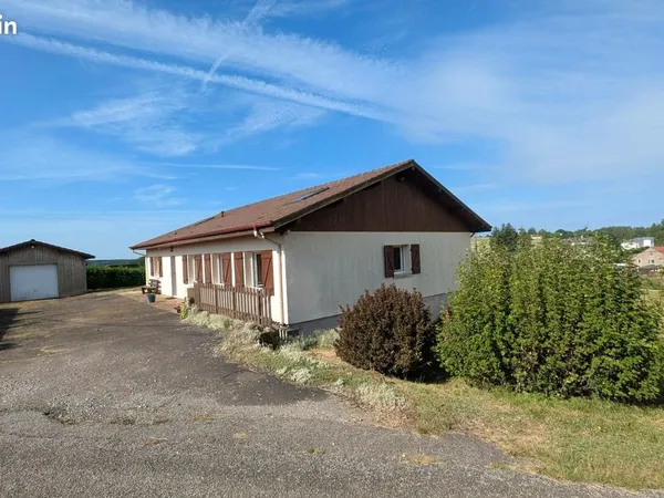 Maison 7 pièces avec terrain, garages et combles aménagés