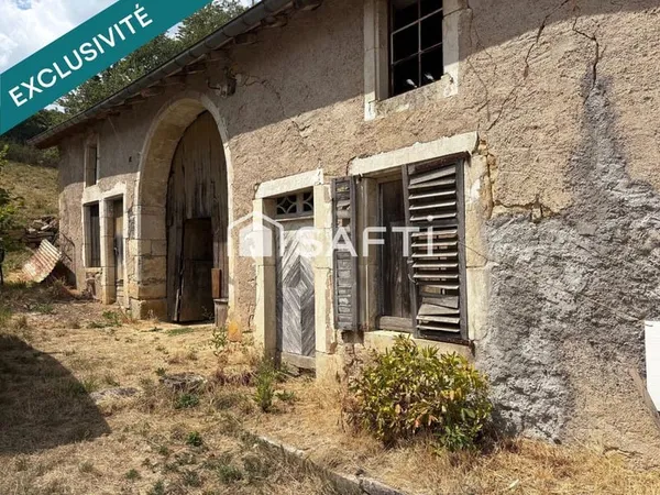 Ancienne grange sur un terrain de 1200 m2 offrant de belles perspectives d'agencements