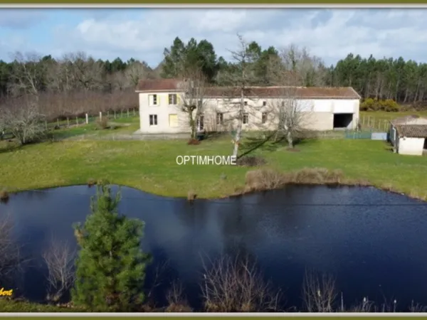 ensemble de 2 maisons+ dependances + grand terrain + étang