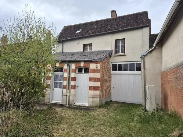 Maison 4 pièces avec garage.
