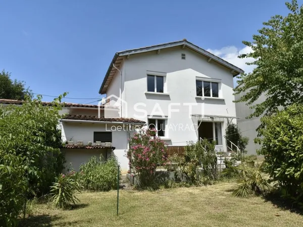Maison 81 m² avec garage et jardin, proche centre.
