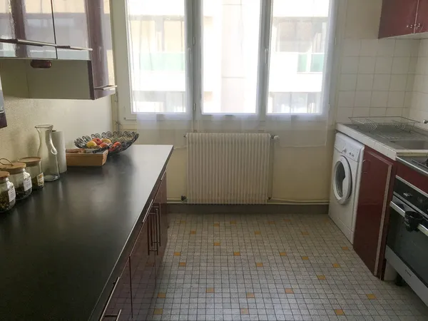 Appartement 70 m² / Garage / Jardin commun