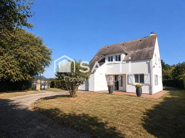Maison individuelle dans un cadre verdoyant