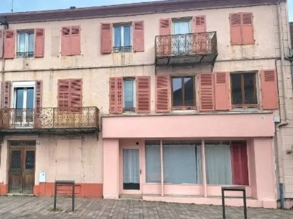 Immeuble comprenant 6 appartements + une surface commerciale