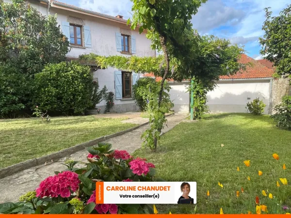 Maison en pierre avec jardin deux garages et dépendances