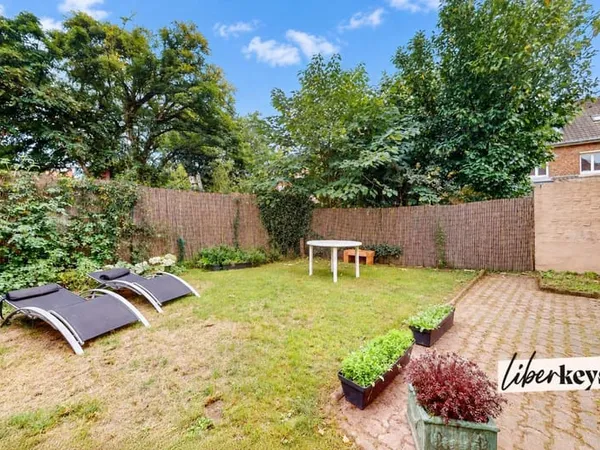 Maison de 120m² avec 4 chambres, jardin, garage, et cave