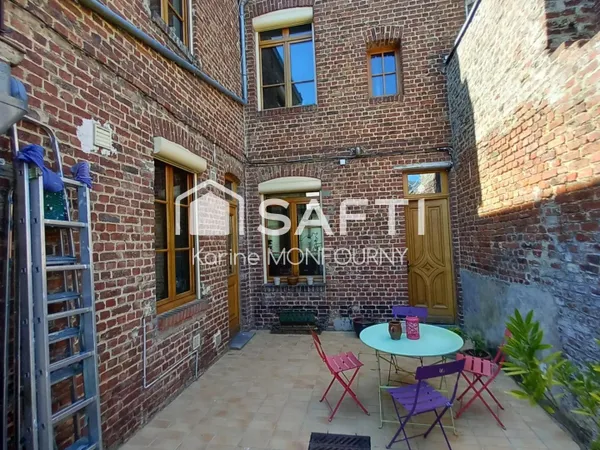 Maison avec petit jardin et cave