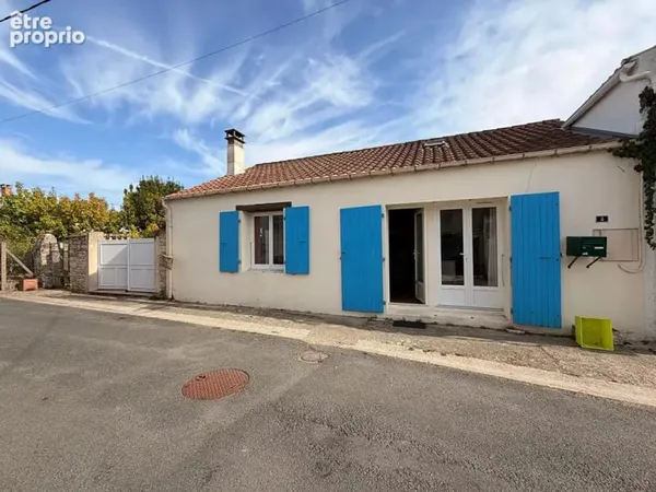 Maison en pierre de charme avec charpente apparente