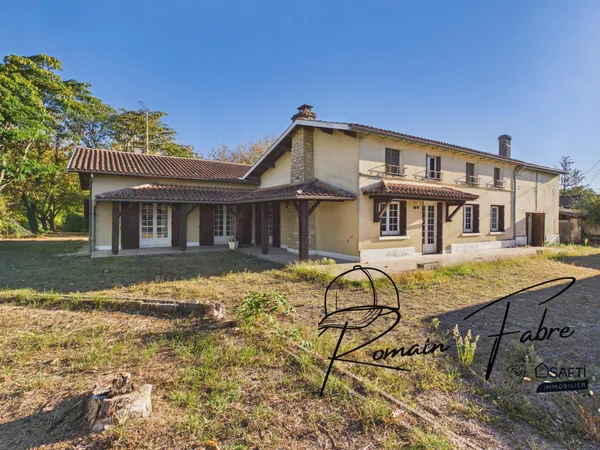 Maison 180m2 de style landais avec 3 chambres, garage, dépendances et grand jardin arboré