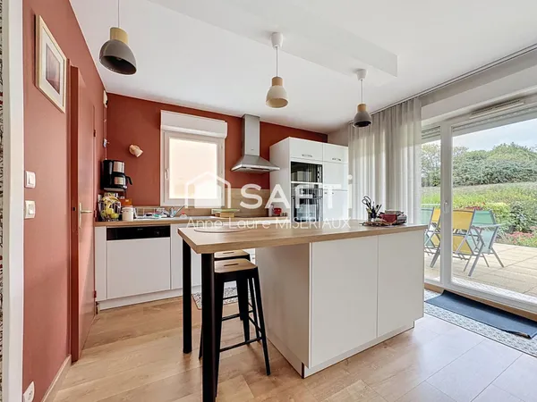 Appartement 2 chambres avec terrasse, jardin et garage fermé