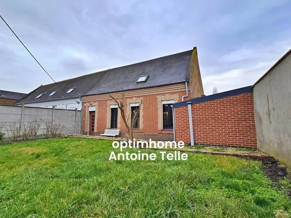 Le Cateau - Maison semi-individuelle à double accès avec garage, devanture & jardin clos