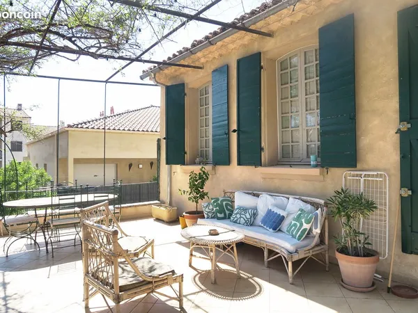 Appartement de 111m2 dans une bâtisse ancienne avec terrasse de 36m2